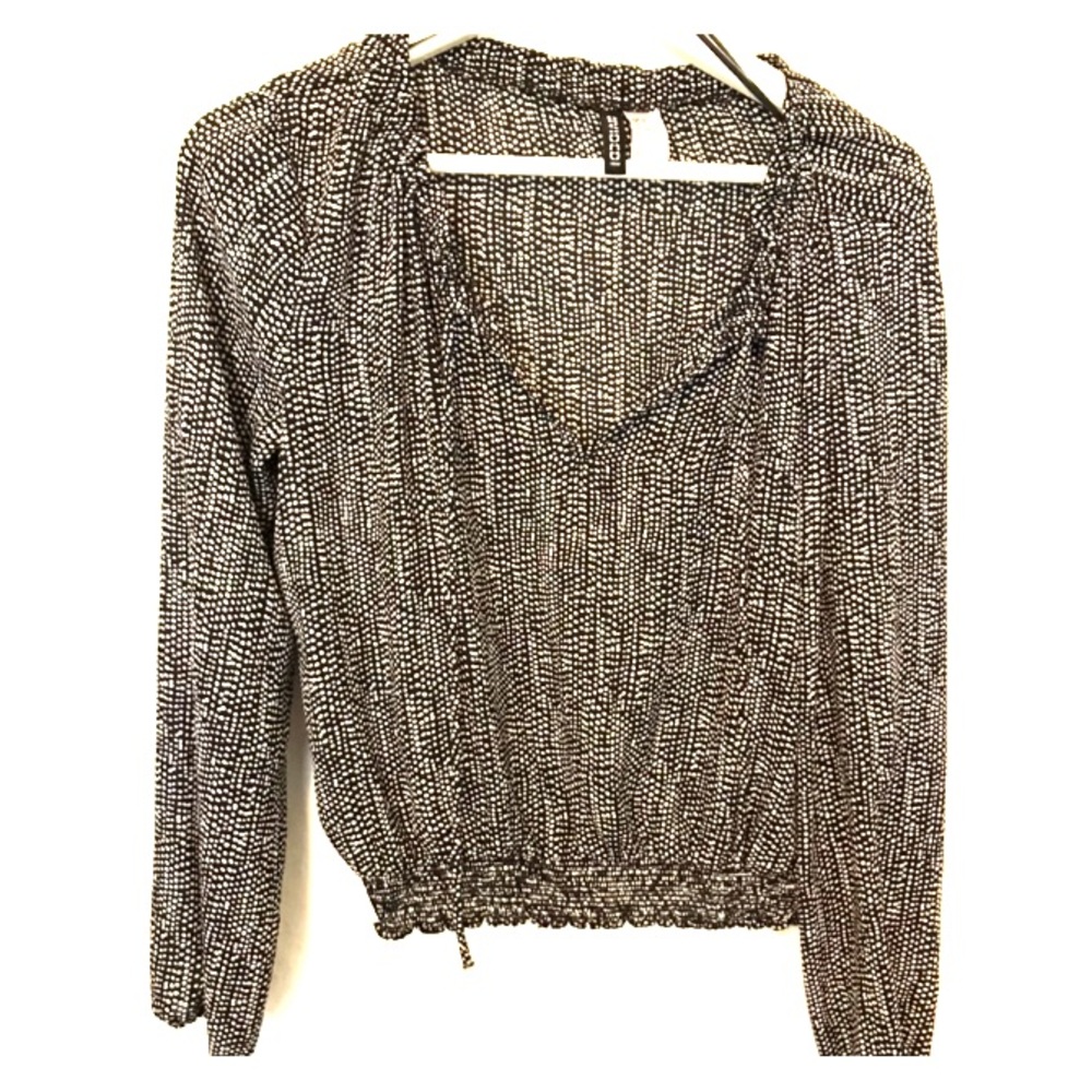 Women’s black & white polka dot blouse.